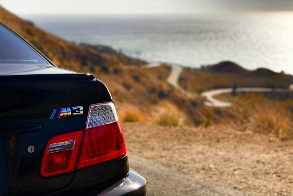 A rear close-up of a BMW E46 M3 badge.