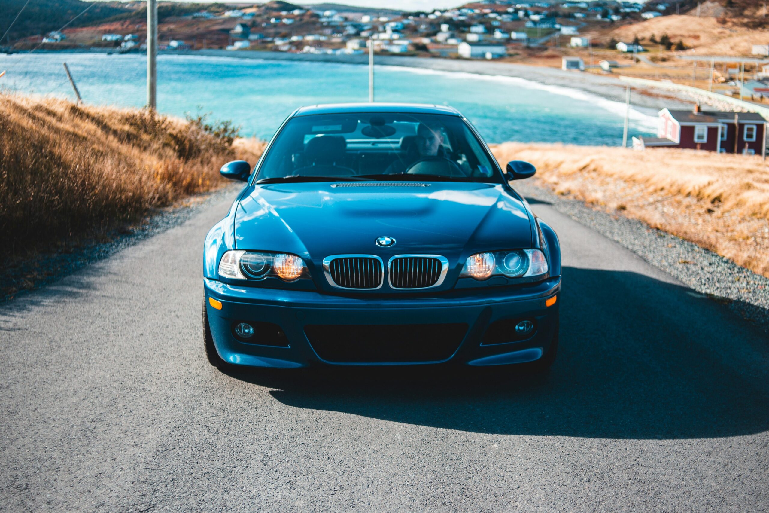A front-end view of a black BMW E46 M3.