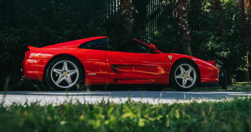 A side-profile shot of a Ferrari F355 Targa.