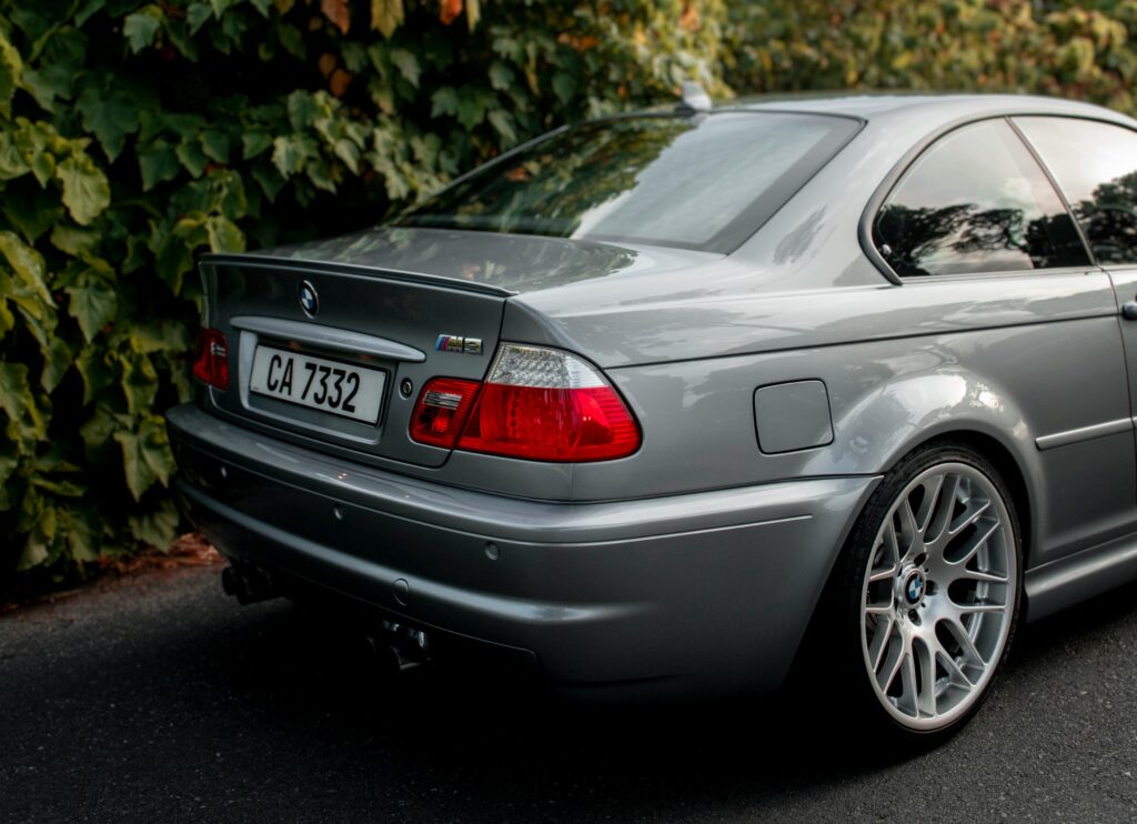 A rear three-quarter view of a silver BMW E46 M3.