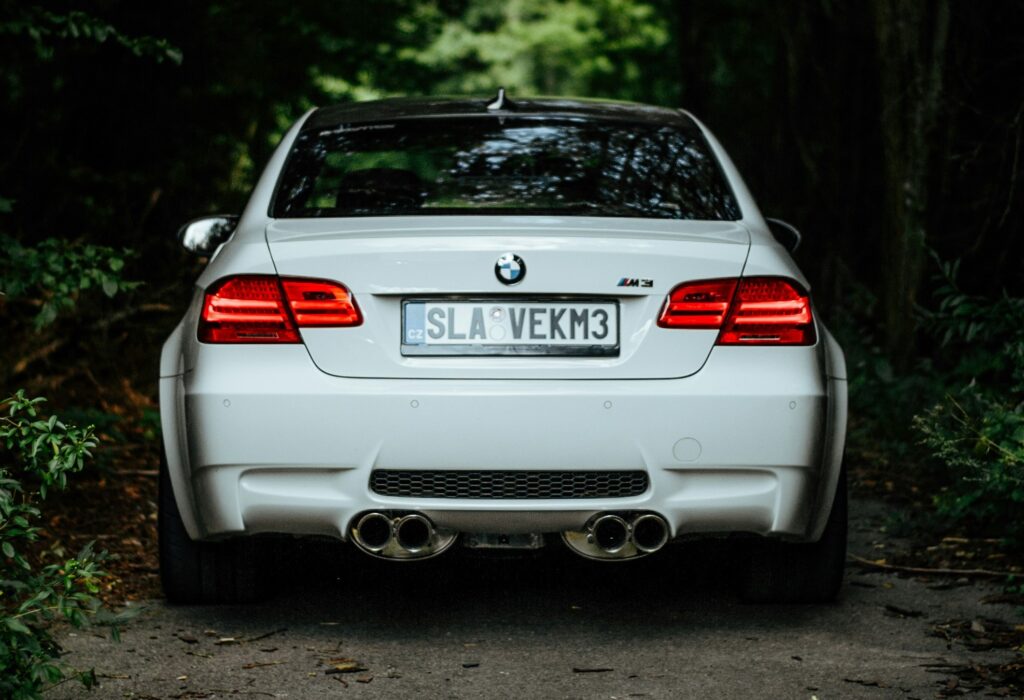 A rear-end view of a white BMW E92 M3.