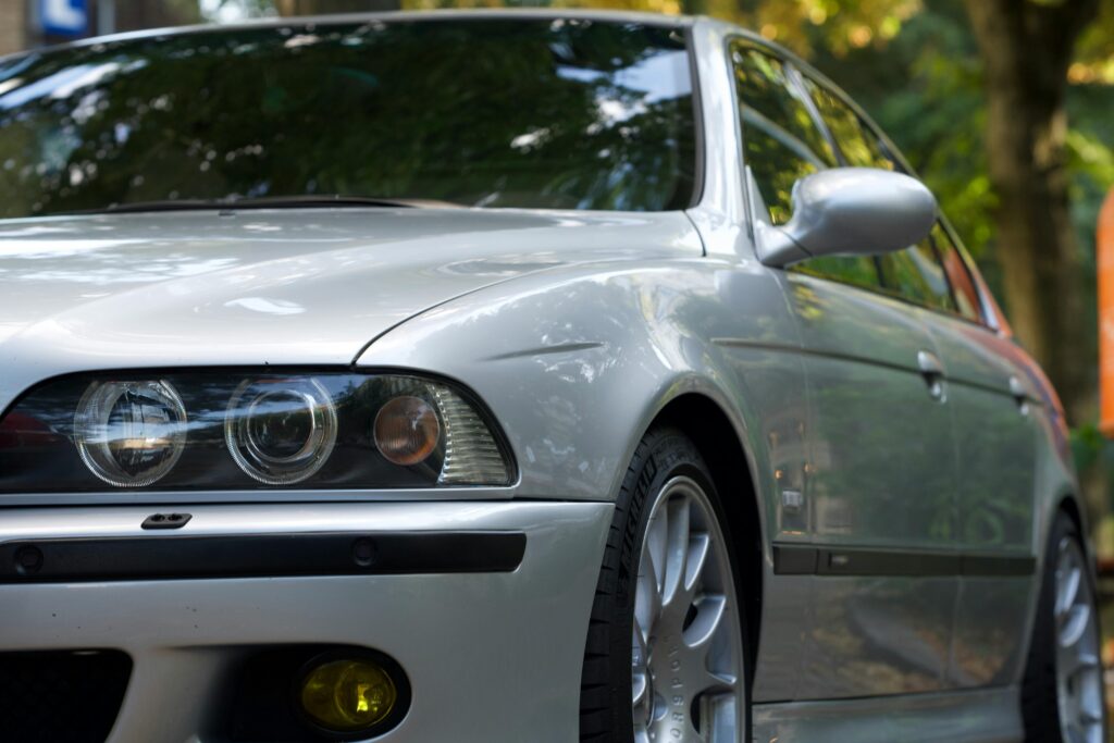 A close-up of a silver BMW E39 M5.