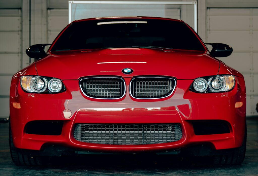 Front-end view of a red BMW E92 M3.
