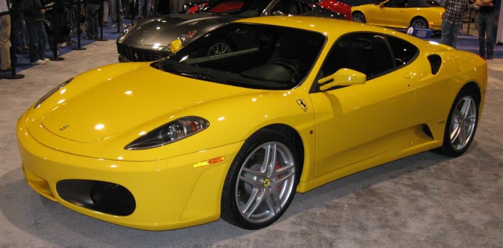 A yellow Ferrari F430 parked.