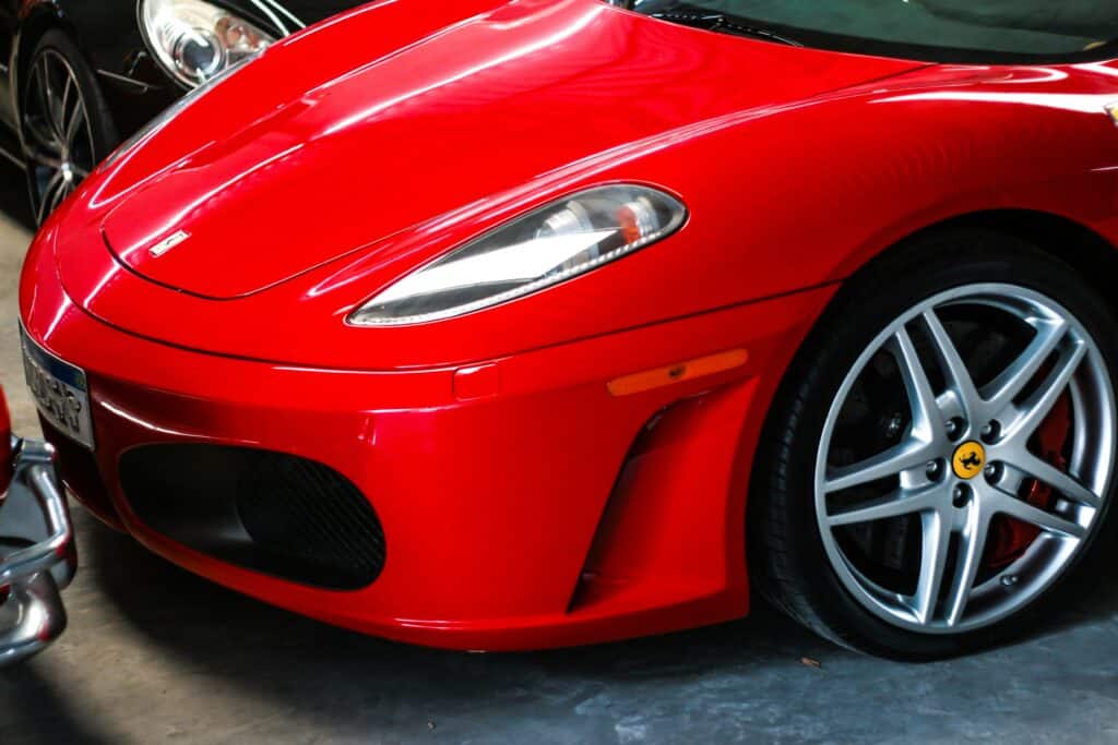 Close-up of a red Ferrari F430 hood.