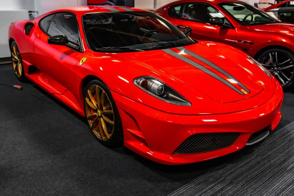 A red Ferrari F430 Investment car parked on display.