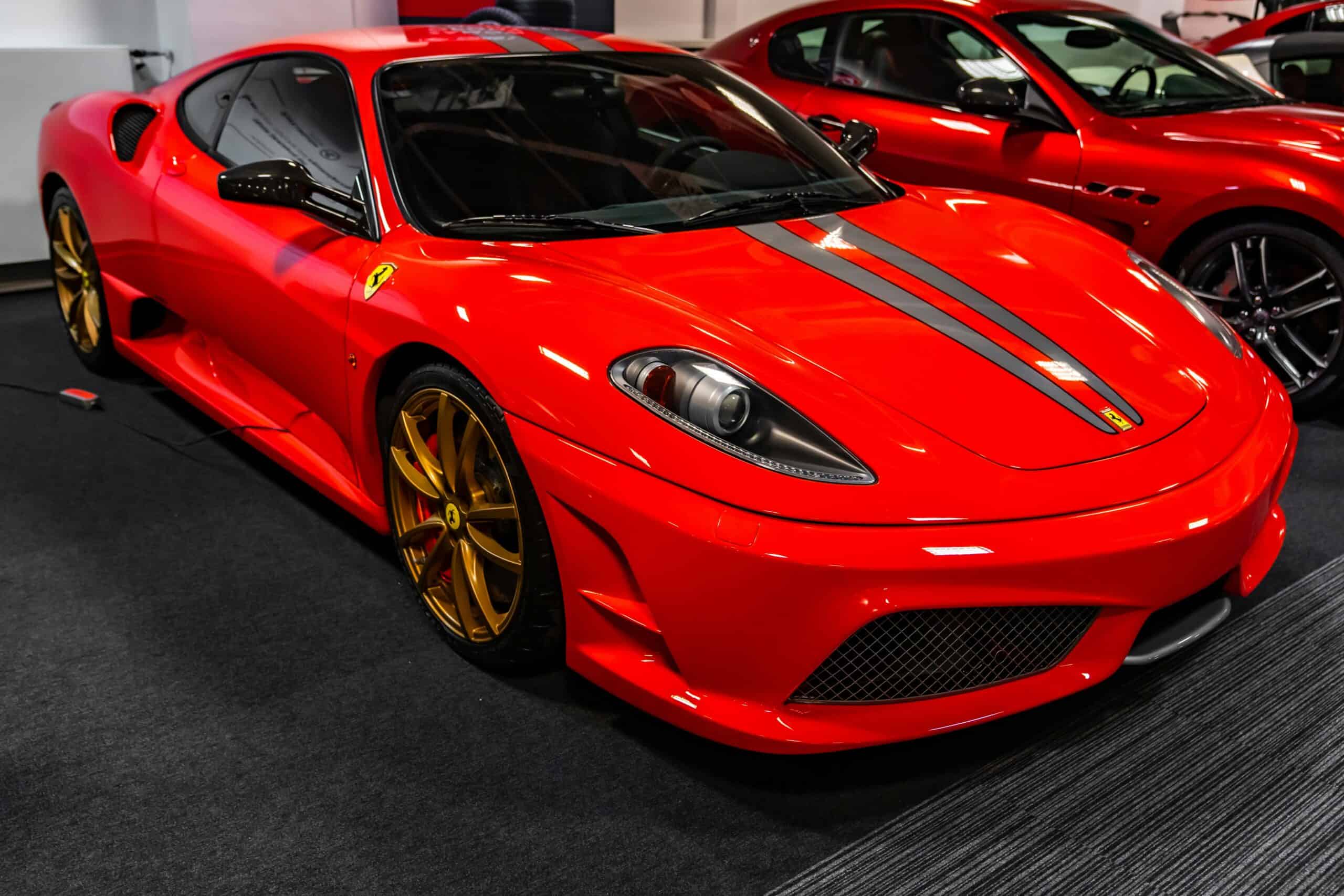 A red Ferrari F430 Investment car parked on display.
