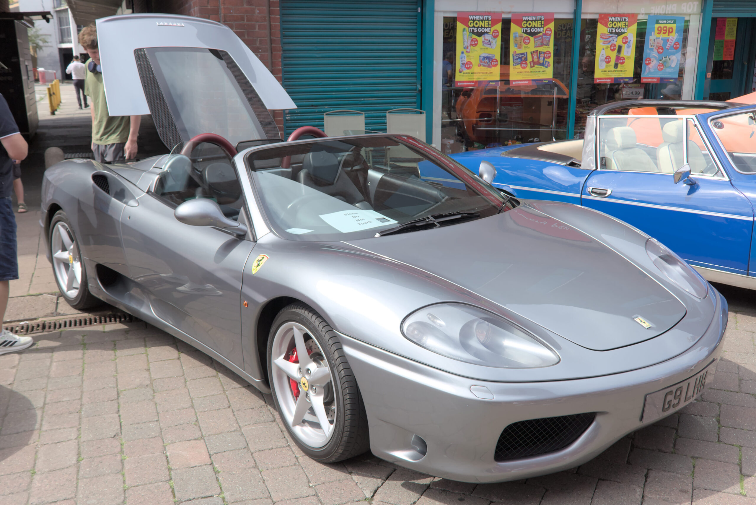A silver Ferrari 360 Spider