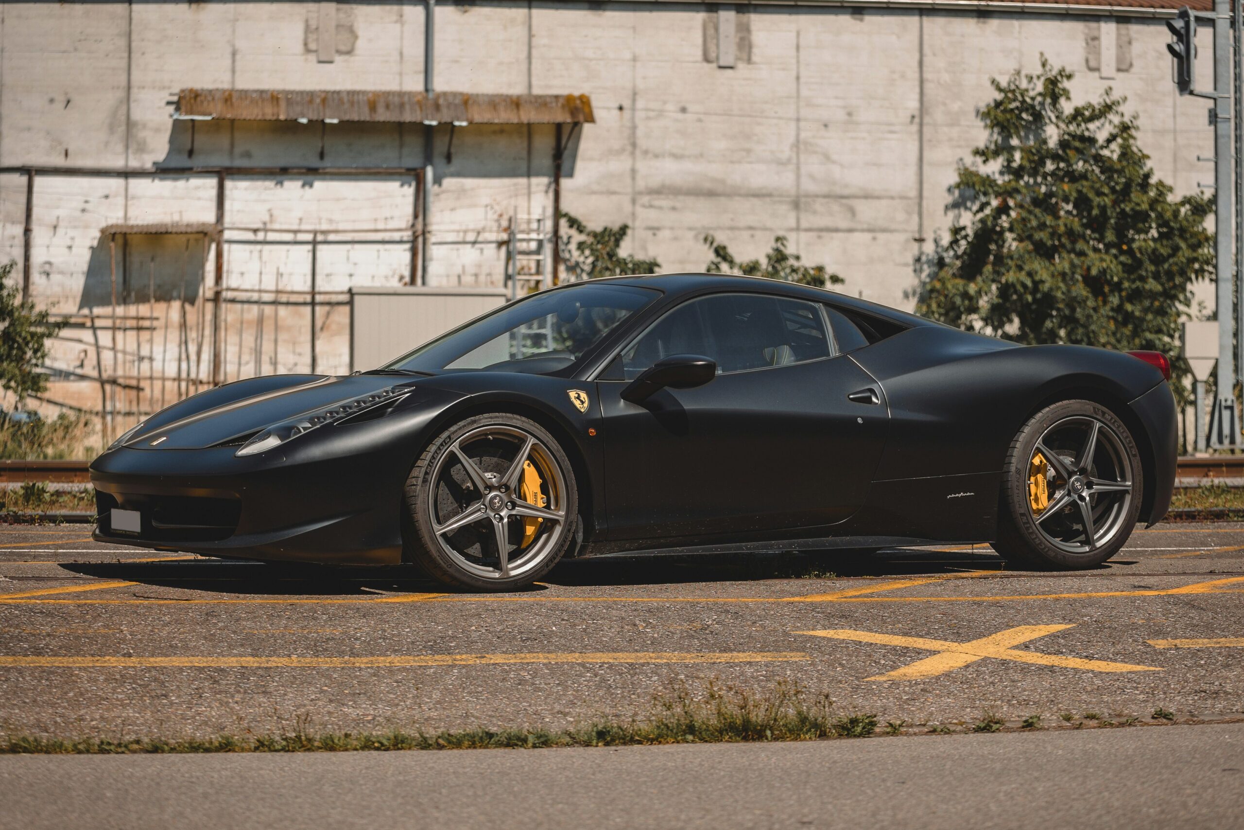 A front three-quarter view of a black Ferrari 458 Italia