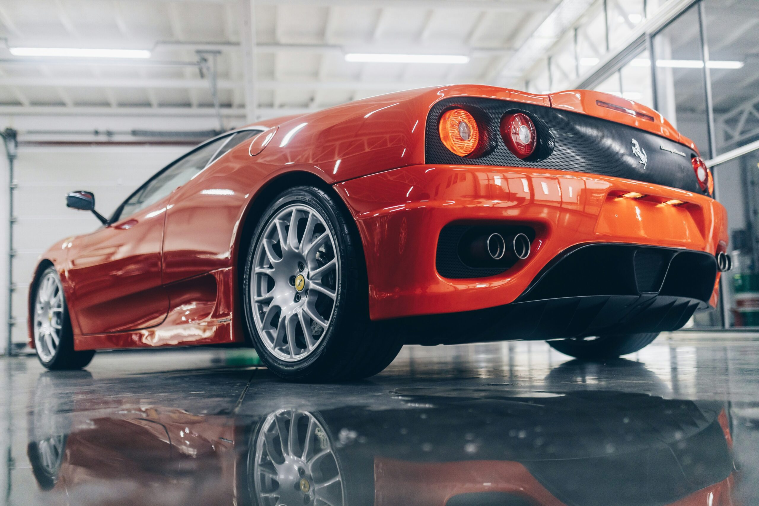 A rear end shot of a red Ferrari 360 Challenge Stradale