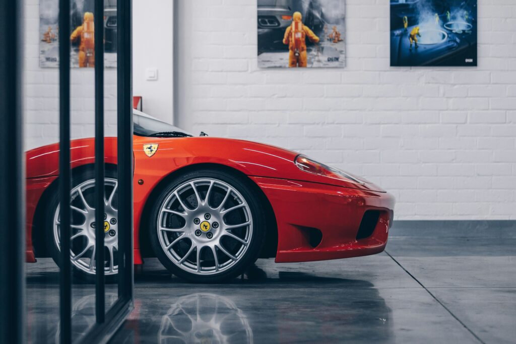 A front fender shot of a red Ferrari 360 Challenge Stradale