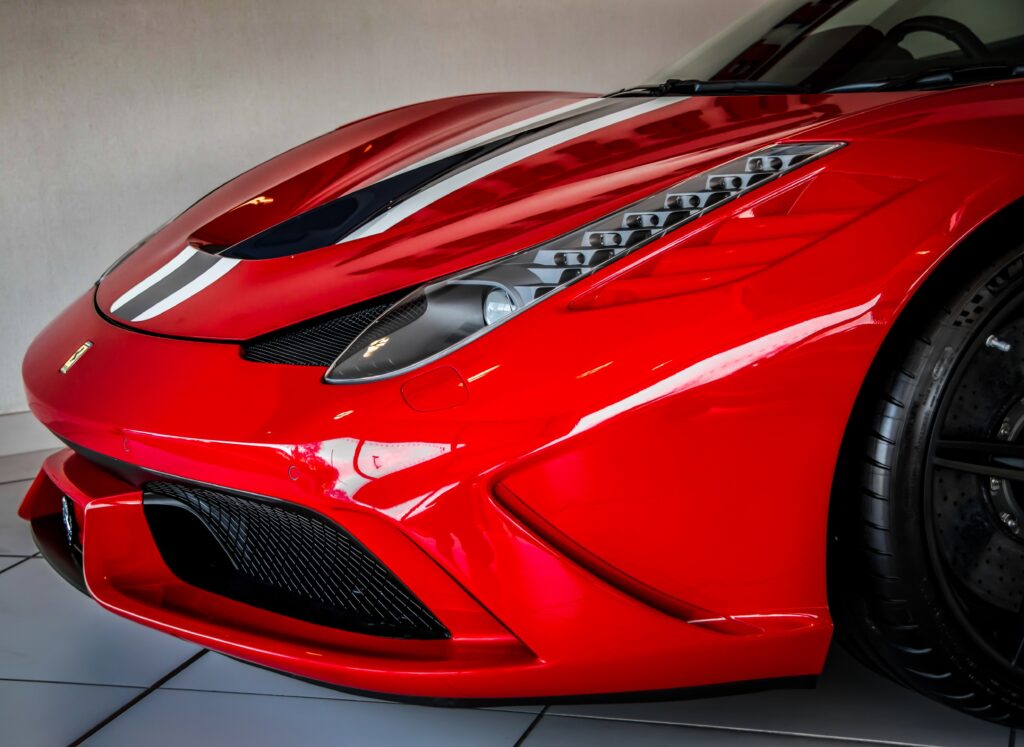 A close-up of a red Ferrari 458 Speciale nose